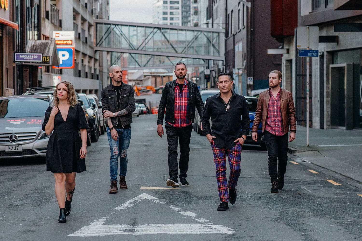 Hands Off covers band walking down Auckland city street