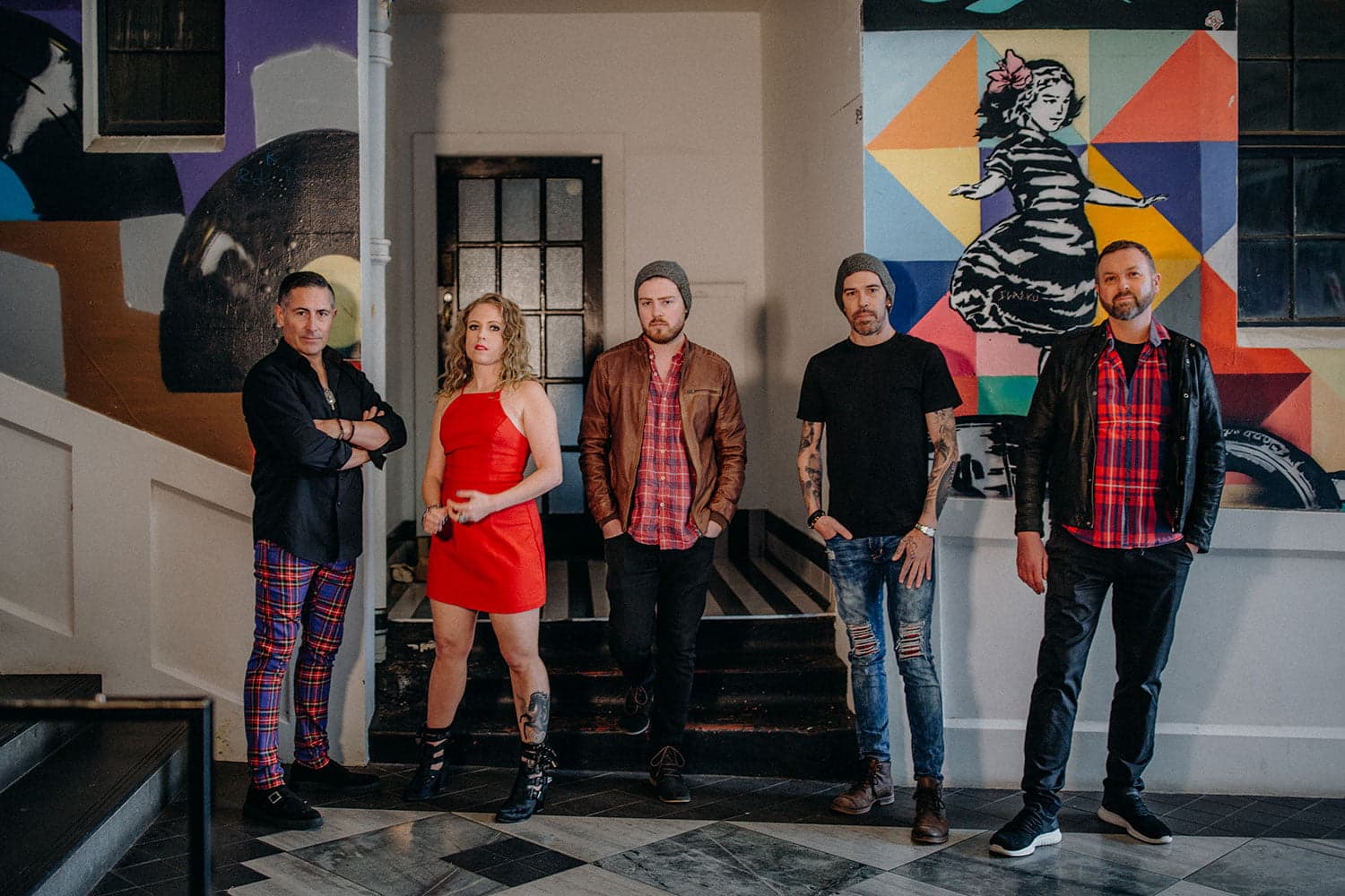 Hands Off band in front of colourful street art — private function entertainment